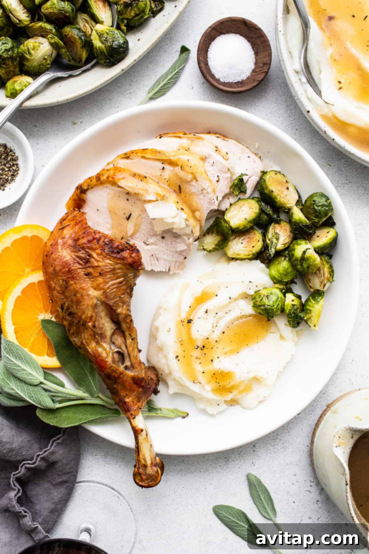 A perfectly roasted whole turkey, carved and ready to serve, surrounded by various side dishes.