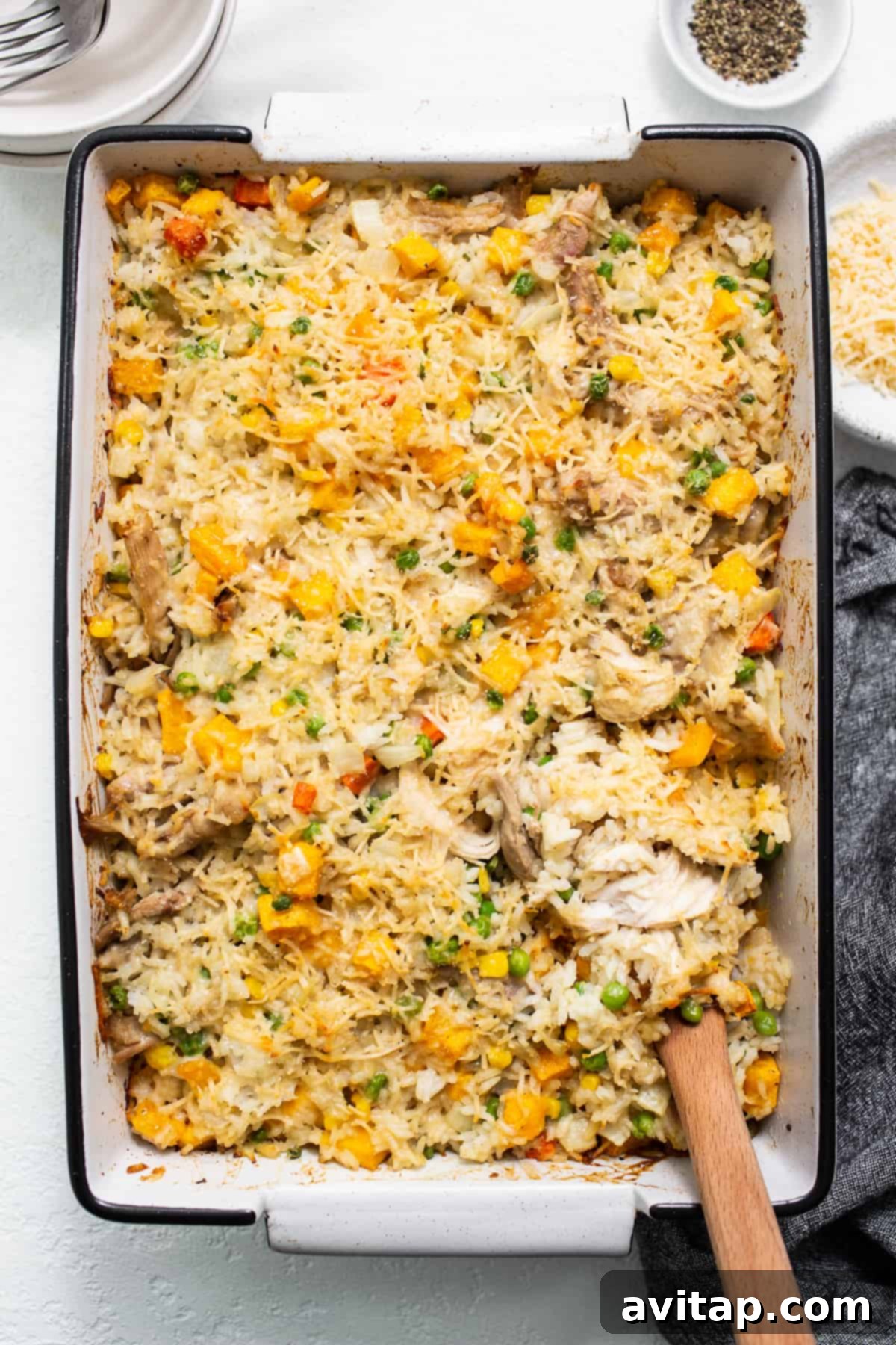 A golden-brown turkey casserole, fresh from the oven, bubbling in a casserole dish.