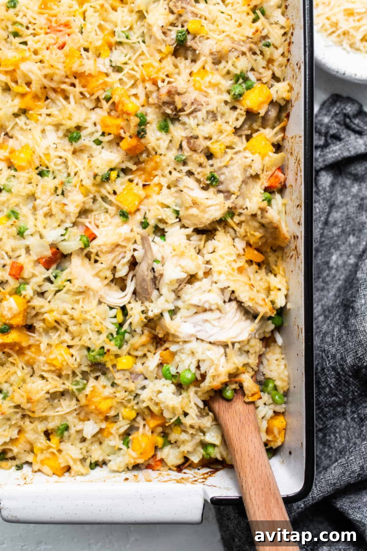 A close-up of the baked turkey casserole, showing the golden cheese topping and creamy interior.