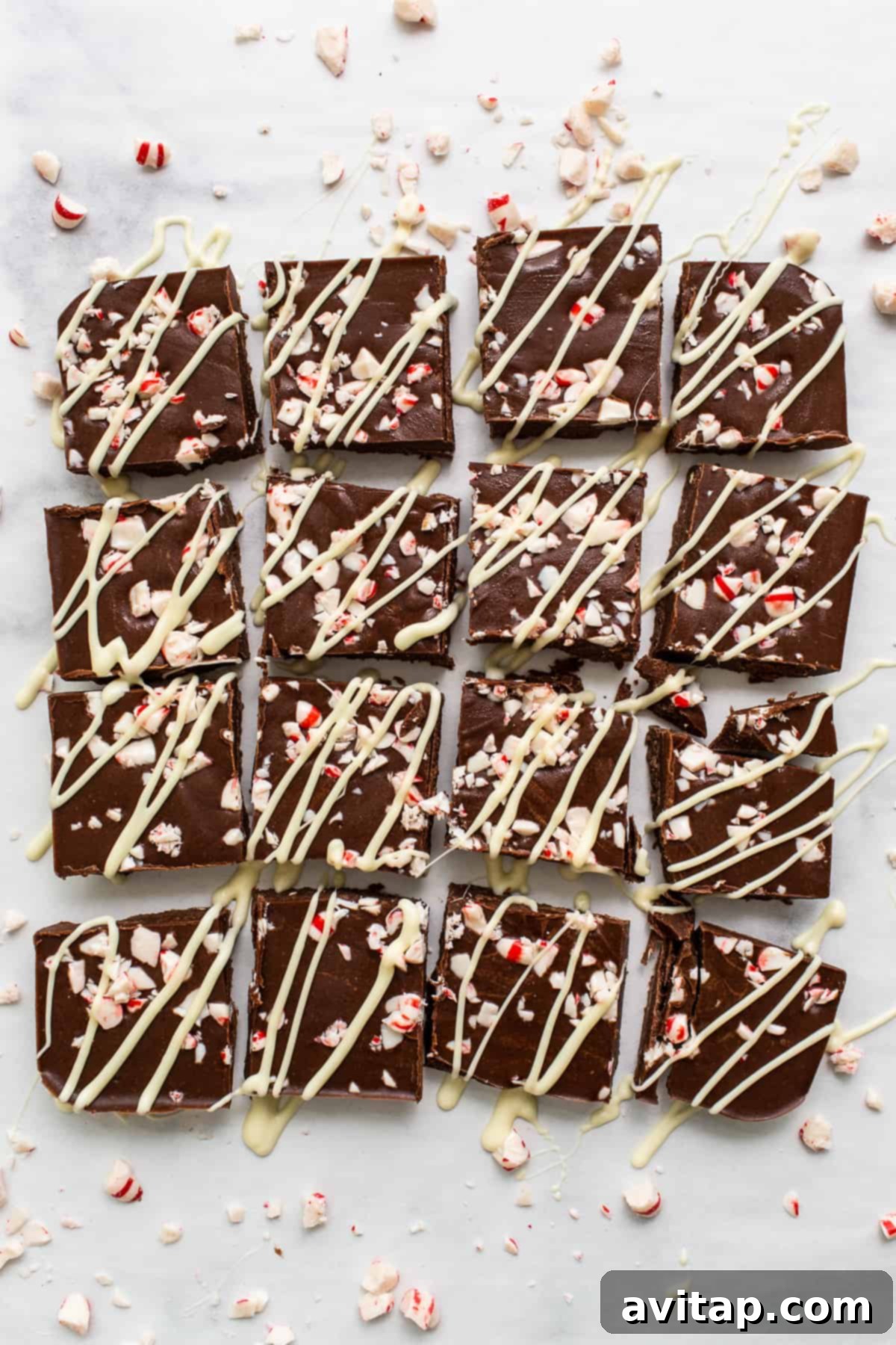 No-Bake Peppermint Fudge 7 Neatly sliced pieces of peppermint freezer fudge arranged for serving.