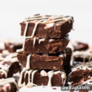 Stacked peppermint freezer fudge pieces.