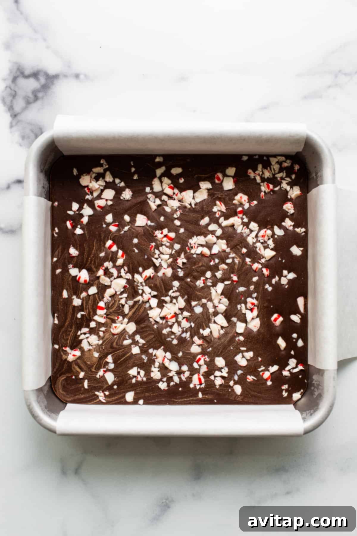 No-Bake Peppermint Fudge 6 Peppermint freezer fudge topped with crushed candy canes for a festive crunch.