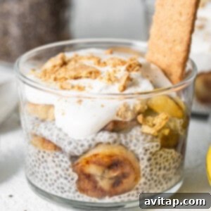 Banana cream pie chia seed pudding in a glass during assembly.