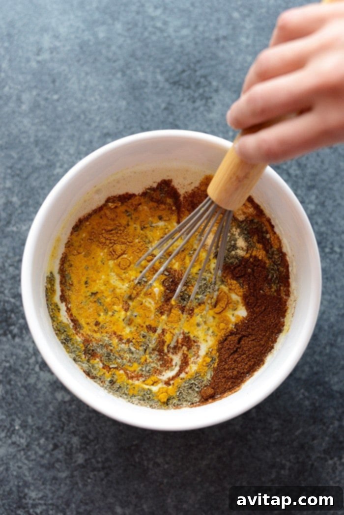 The Sweet Potato Green Curry Quinoa Casserole dished out into individual portions, garnished and ready for a meal, emphasizing its appeal as a healthy and satisfying option.