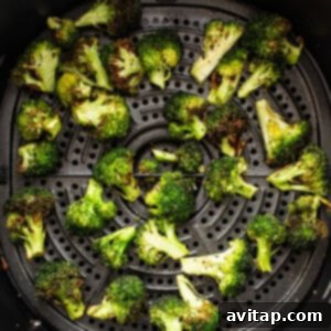 An air fryer filled with broccoli.
