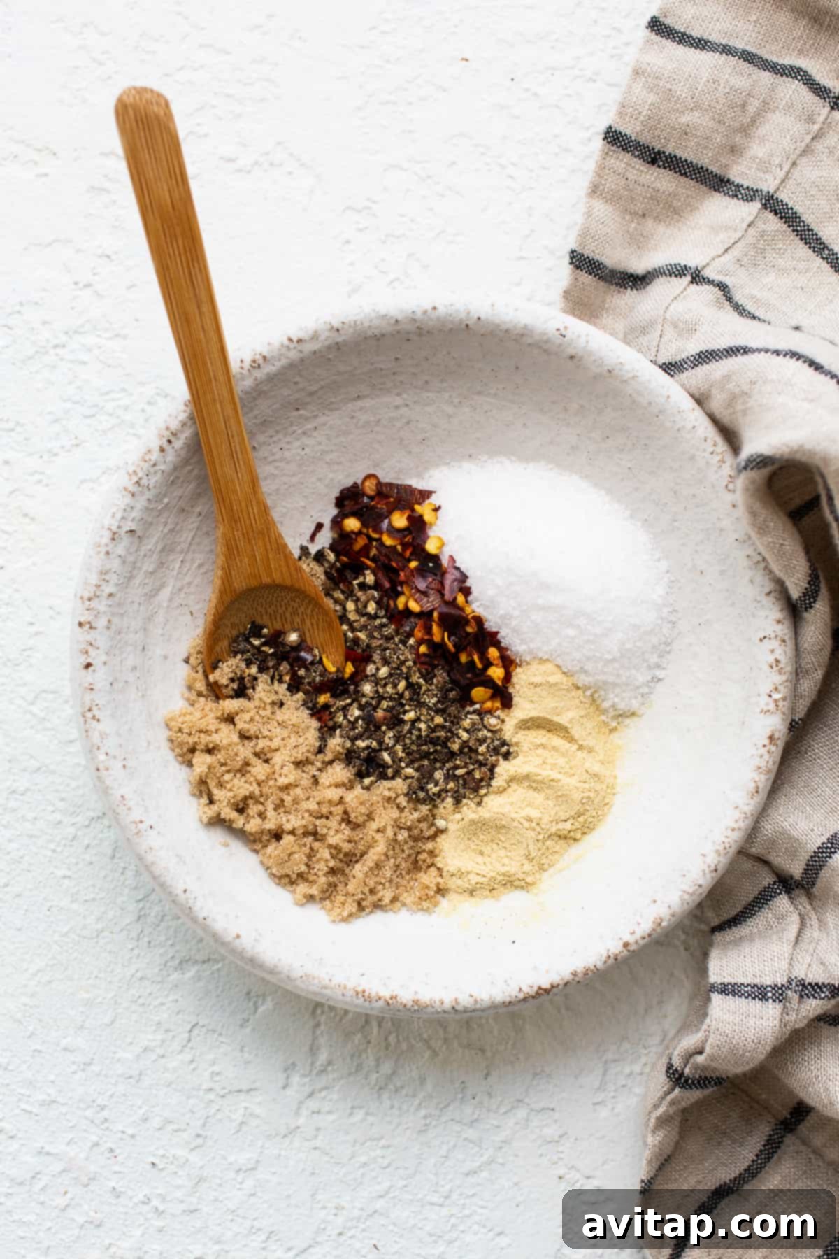 Craft your own homemade steak seasoning with just 5 common ingredients for unparalleled flavor. Steak seasoning ingredients in a bowl, ready to be mixed for a delicious homemade blend.