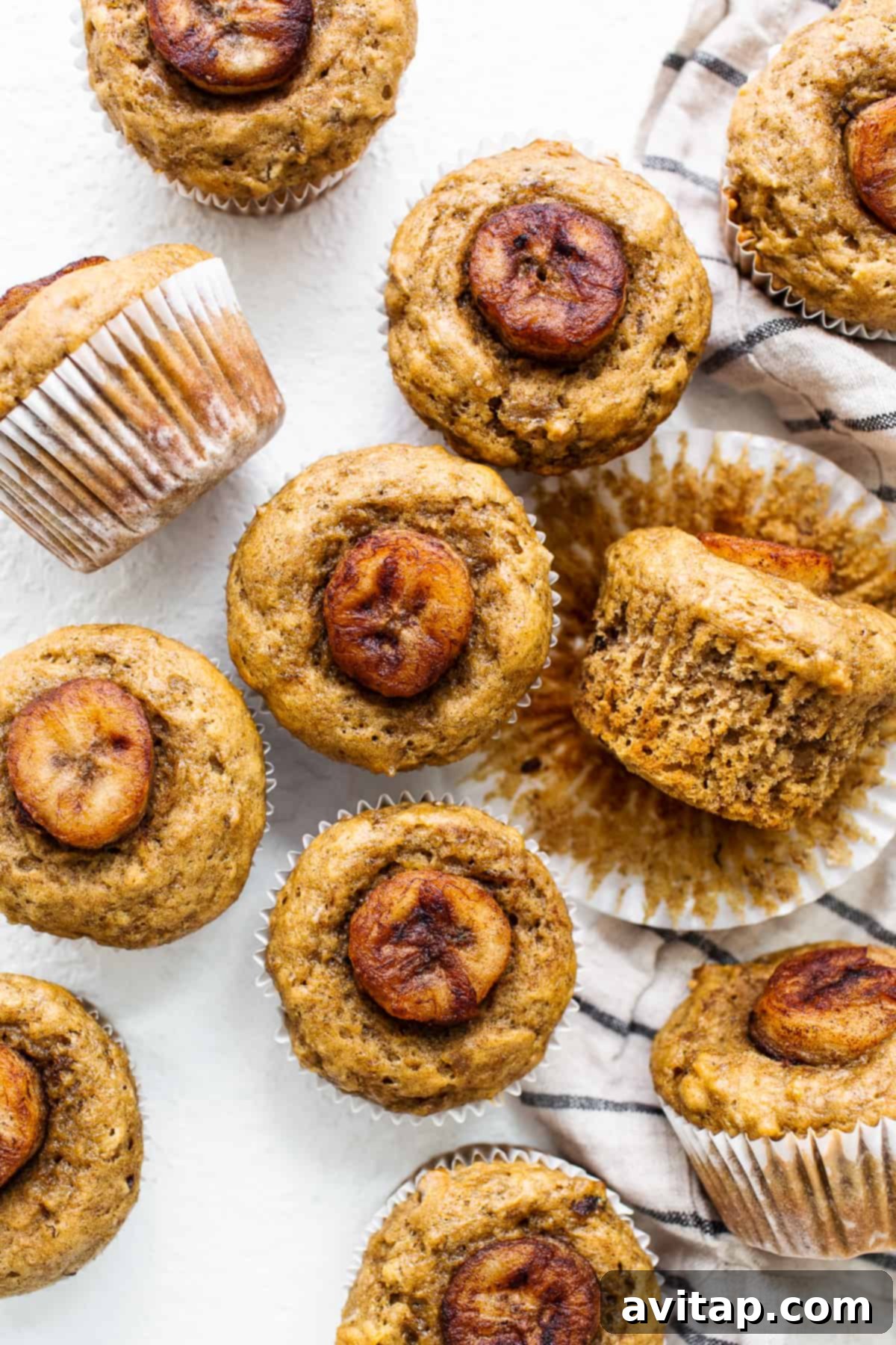 Decadent Bananas Foster Muffins 5 A close-up shot of a single Bananas Foster Muffin, highlighting its caramelized topping and tender texture.