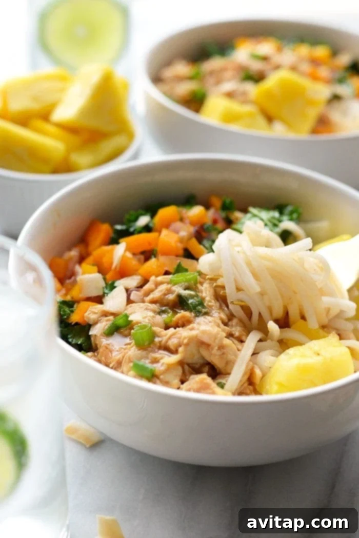 Island Chicken Noodle Feast 2 Delicious Hawaiian Chicken Noodle Bowls with shredded chicken, vibrant vegetables, and rice noodles, perfect for meal prep.