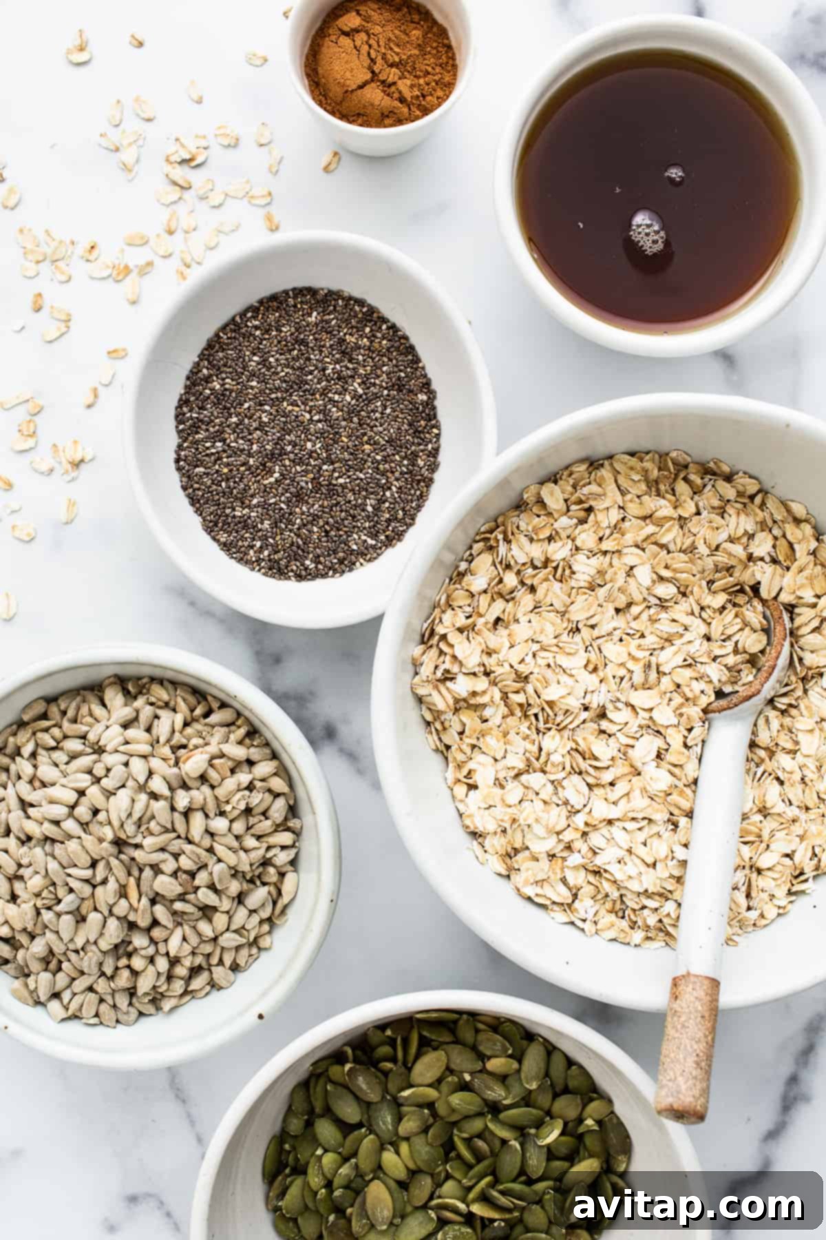 Small bowls displaying the individual ingredients required for preparing the porridge.