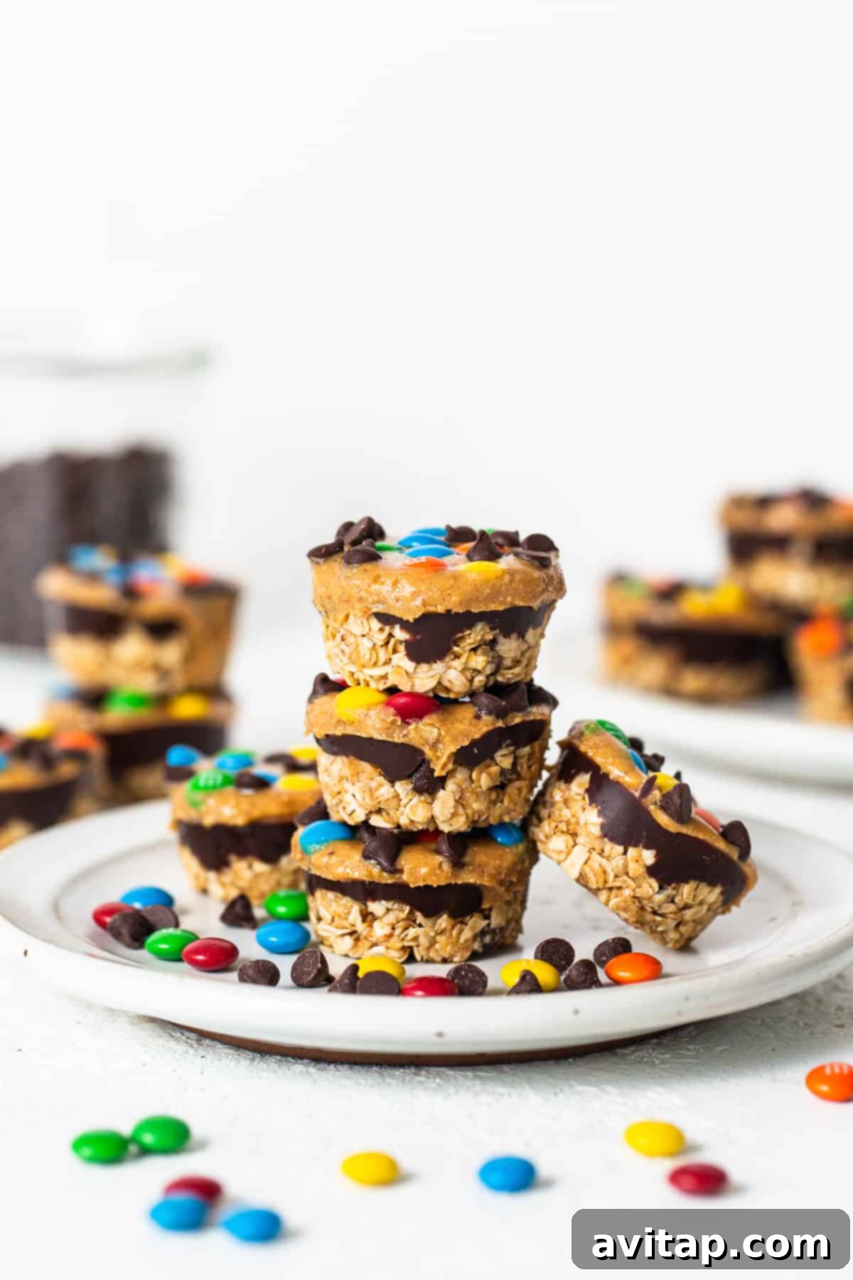 Monster cookie oat cups stacked neatly on a plate, ready for serving.