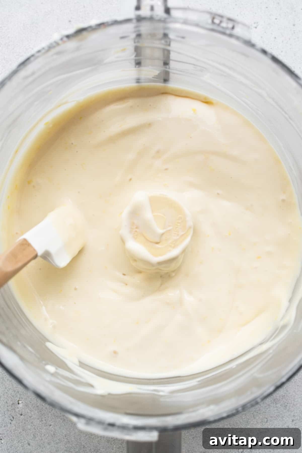 This mini cheesecake recipe is made with a sweet and salty crust, cream cheese, honey, vanilla, and lemon zest making them the perfect Spring dessert. cheesecake filling in bowl.