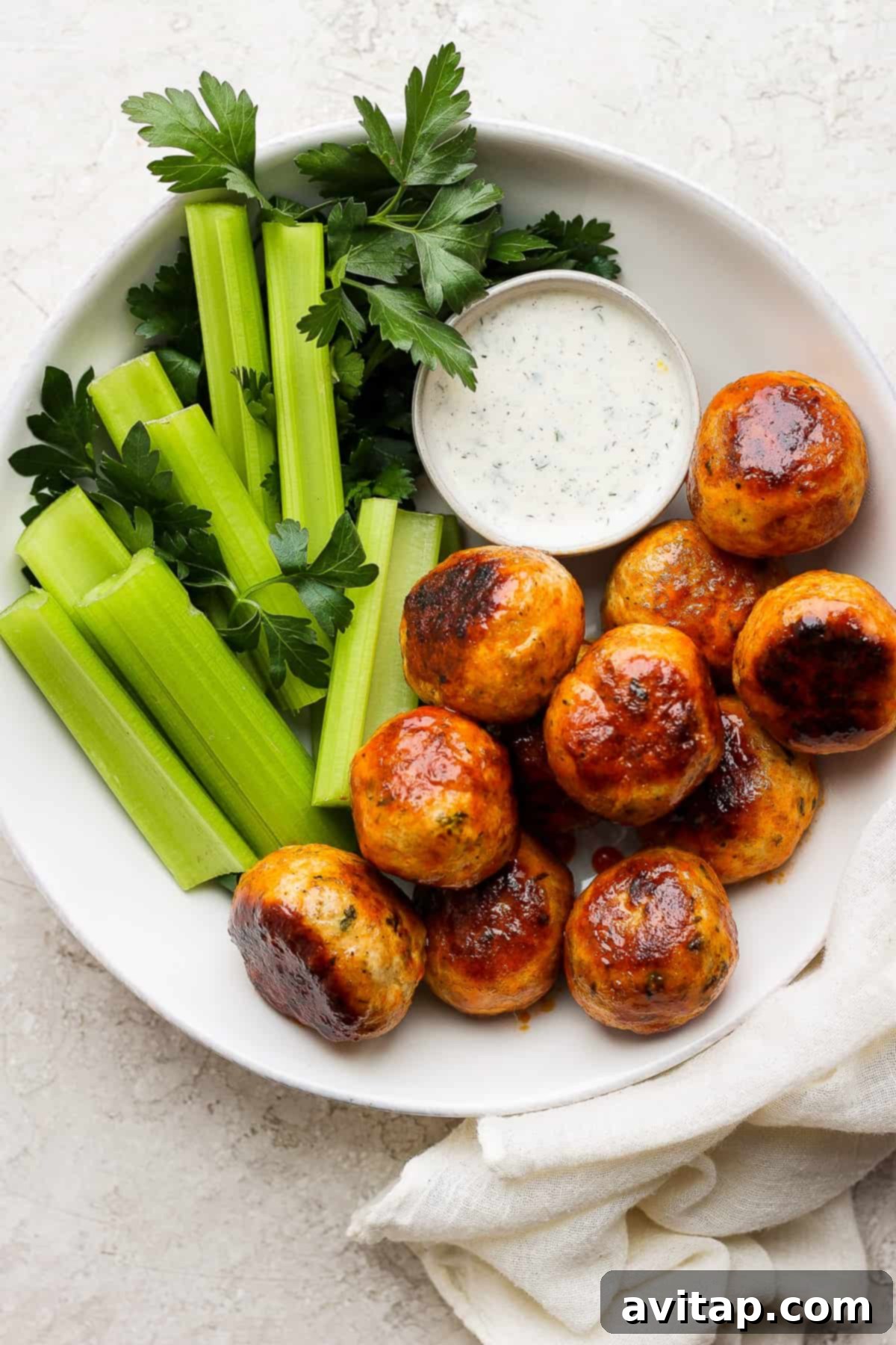 buffalo chicken meatballs on plate wiht ranch.