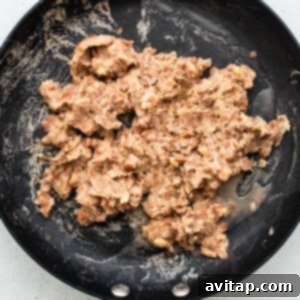refried beans in pan.