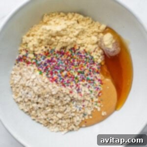 Protein cake pop ingredients mixed in a bowl, showing a creamy texture.