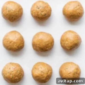 Protein cake pop balls on a cookie sheet.