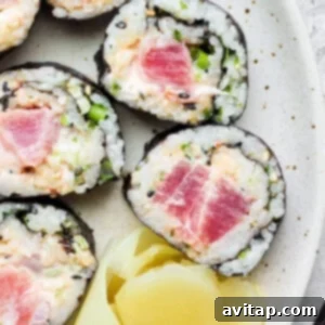 Japanese tuna sushi on a plate, beautifully arranged.
