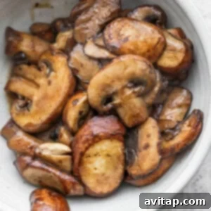 roasted mushrooms in a white bowl.