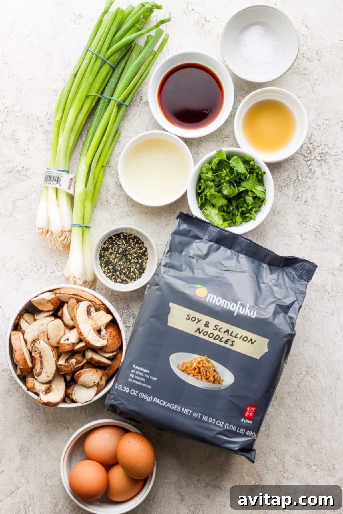 the ingredients for asian fried rice are laid out on a table.