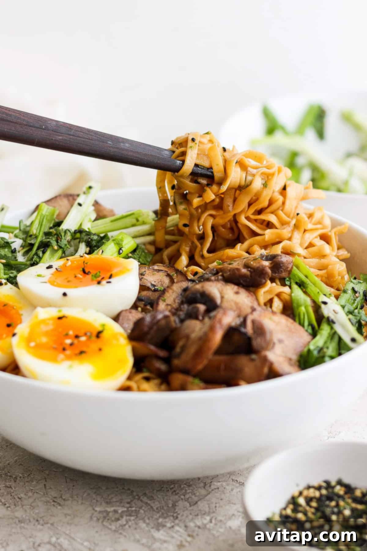 a bowl of asian noodle bowl with an egg and vegetables.