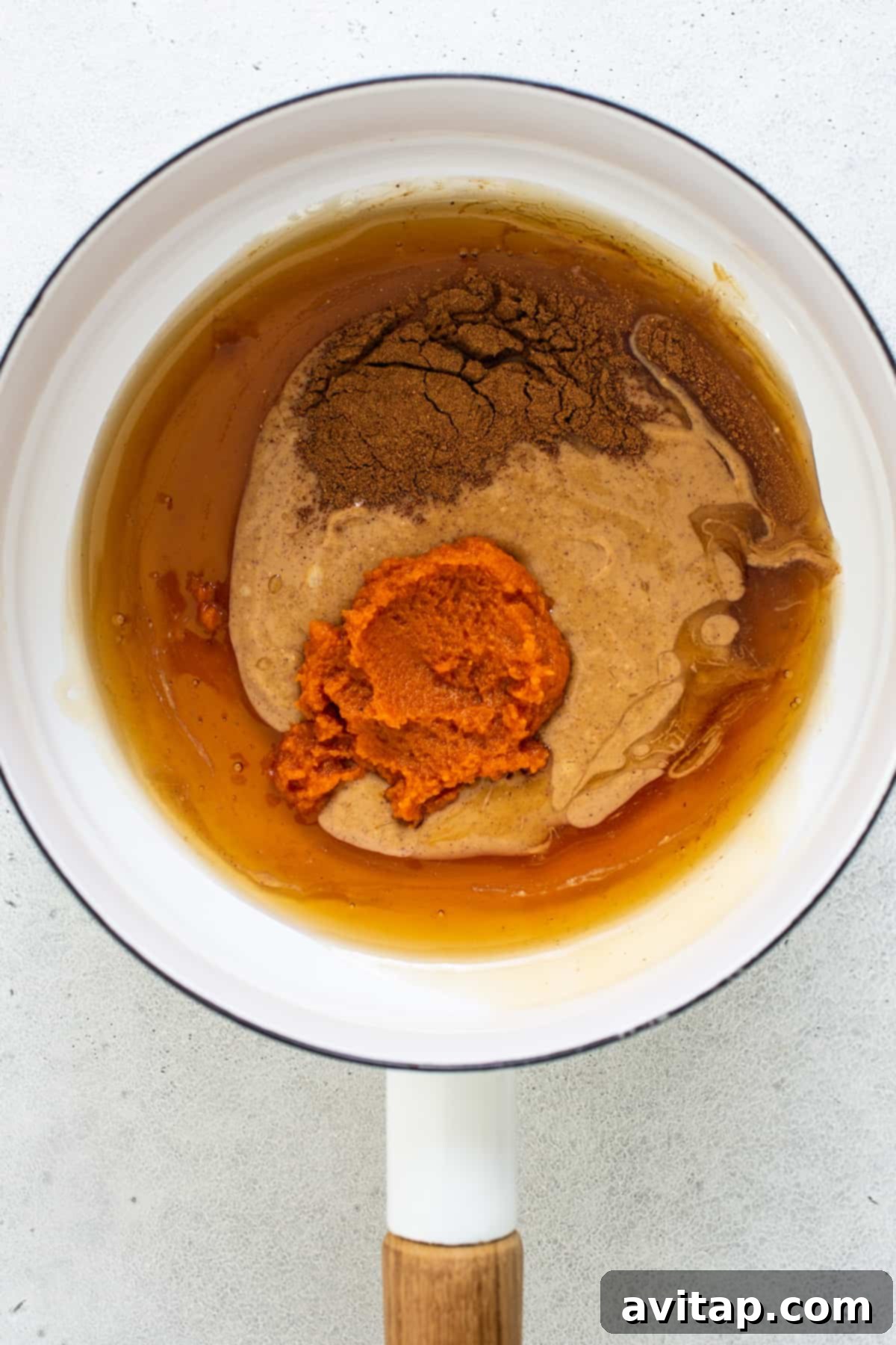 Pumpkin Spice Peanut Butter Crunch Bars 4 A frying pan filled with a mixture of brown and orange.