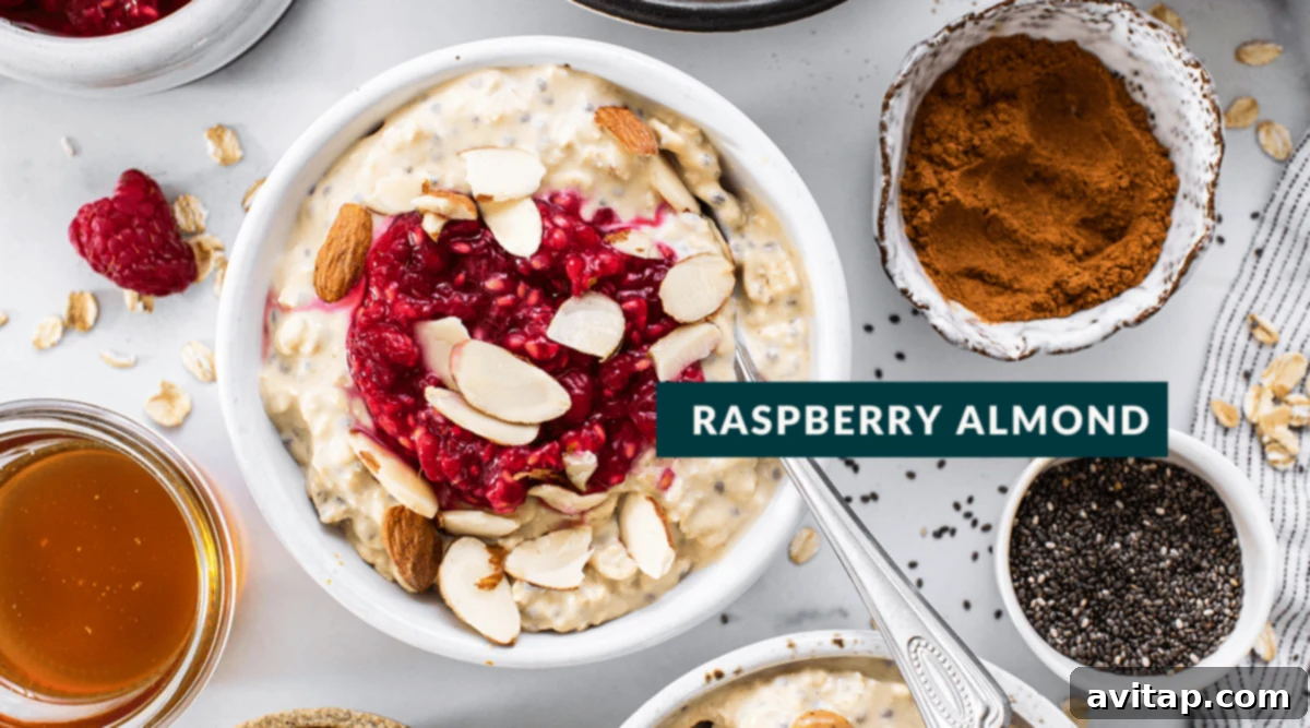 Protein Overnight Oats Three Delicious Varieties 8 A vibrant bowl of raspberry almond protein overnight oats, topped with fresh raspberries and slivered almonds, creating a beautiful and refreshing visual.