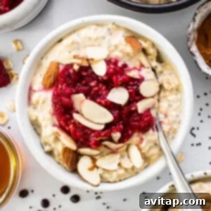 A delicious bowl of oatmeal topped with fruit and nuts, illustrating the protein overnight oats recipe.