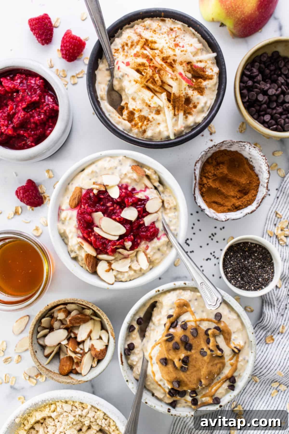 Protein Overnight Oats Three Delicious Varieties 4 A rustic wooden table adorned with an array of colorful overnight oat bowls, each garnished with different fruits and toppings, showcasing diverse flavor combinations.