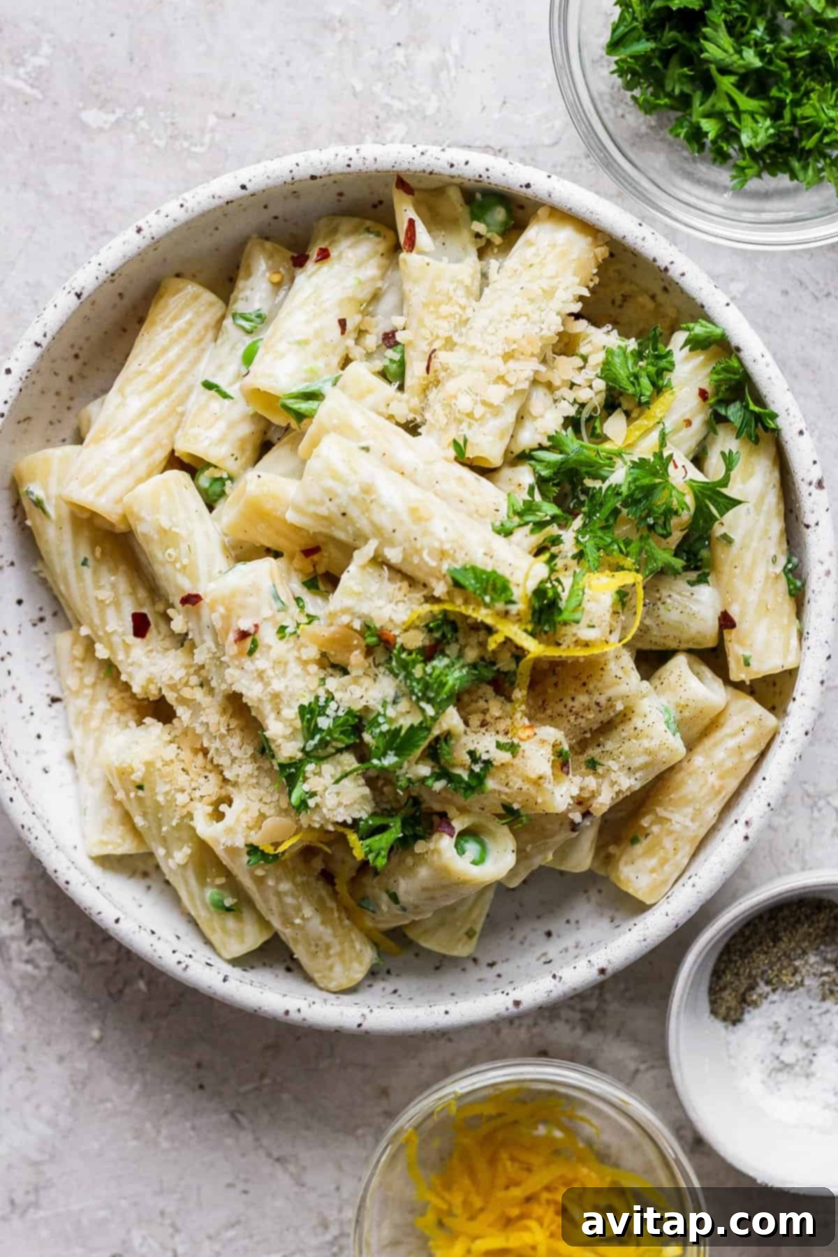 Creamy One-Pot Boursin Pasta 7 Penne pasta with lemon and herbs in a white bowl, a simple and elegant serving suggestion.