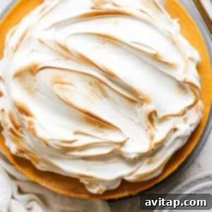 A pie with meringue topping on a plate.