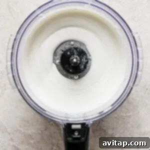A bowl of yogurt in a blender with a lid.