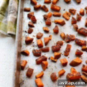 Roasted sweet potatoes on a baking sheet.