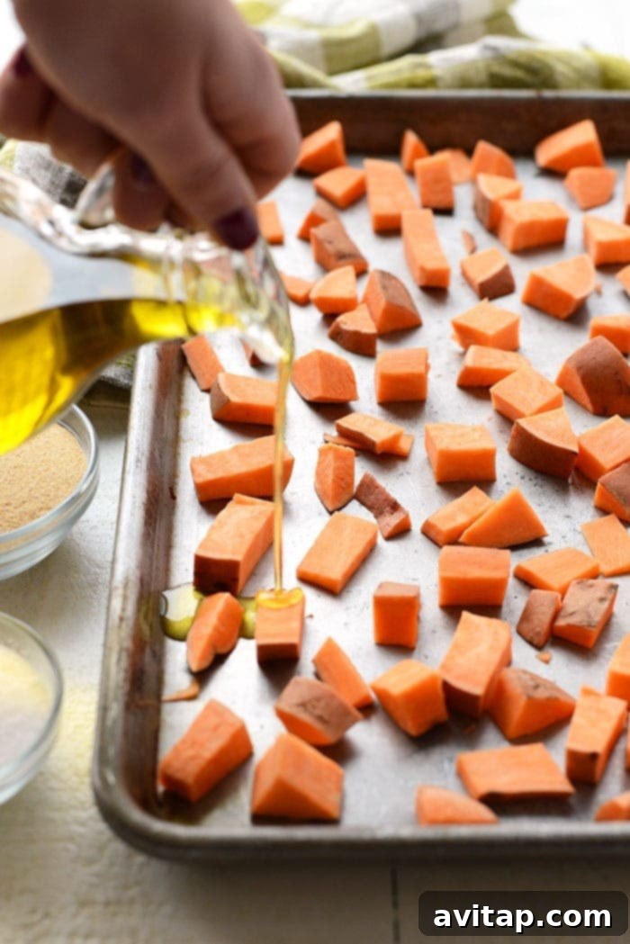 Roasted sweet potatoes are the most delicious vegetable addition to any meal. In this post, we're teaching you how to roast sweet potatoes perfectly every time. cubed sweet potatoes with olive oil