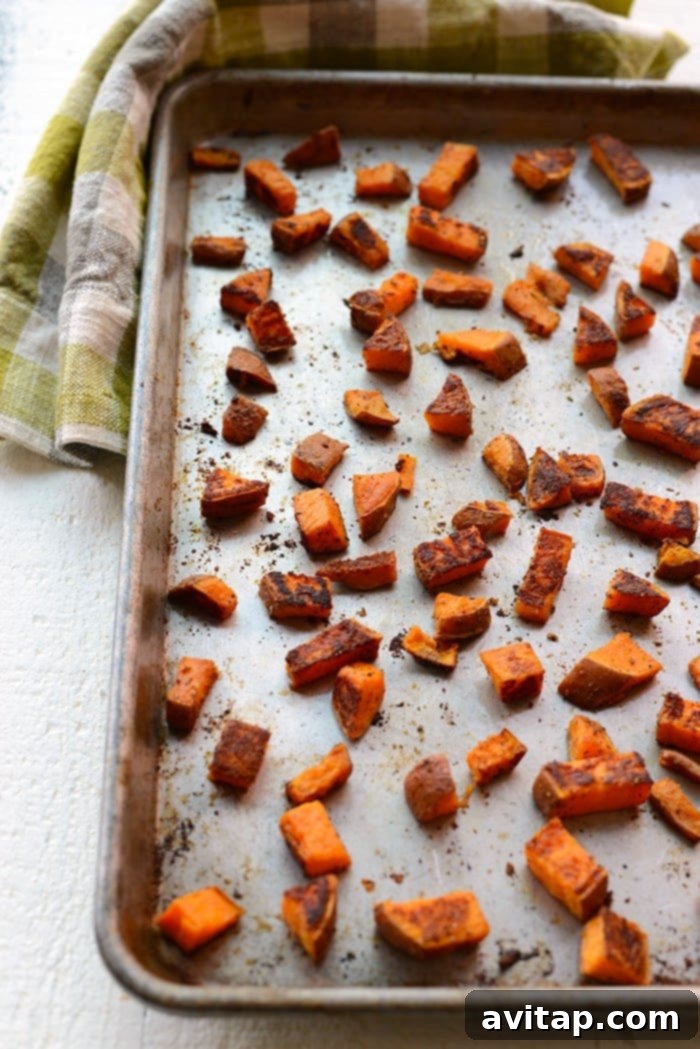 Roasted sweet potatoes are the most delicious vegetable addition to any meal. In this post, we're teaching you how to roast sweet potatoes perfectly every time. crispy roasted sweet potatoes on baking sheet