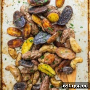 roasted potatoes with herbs on top.