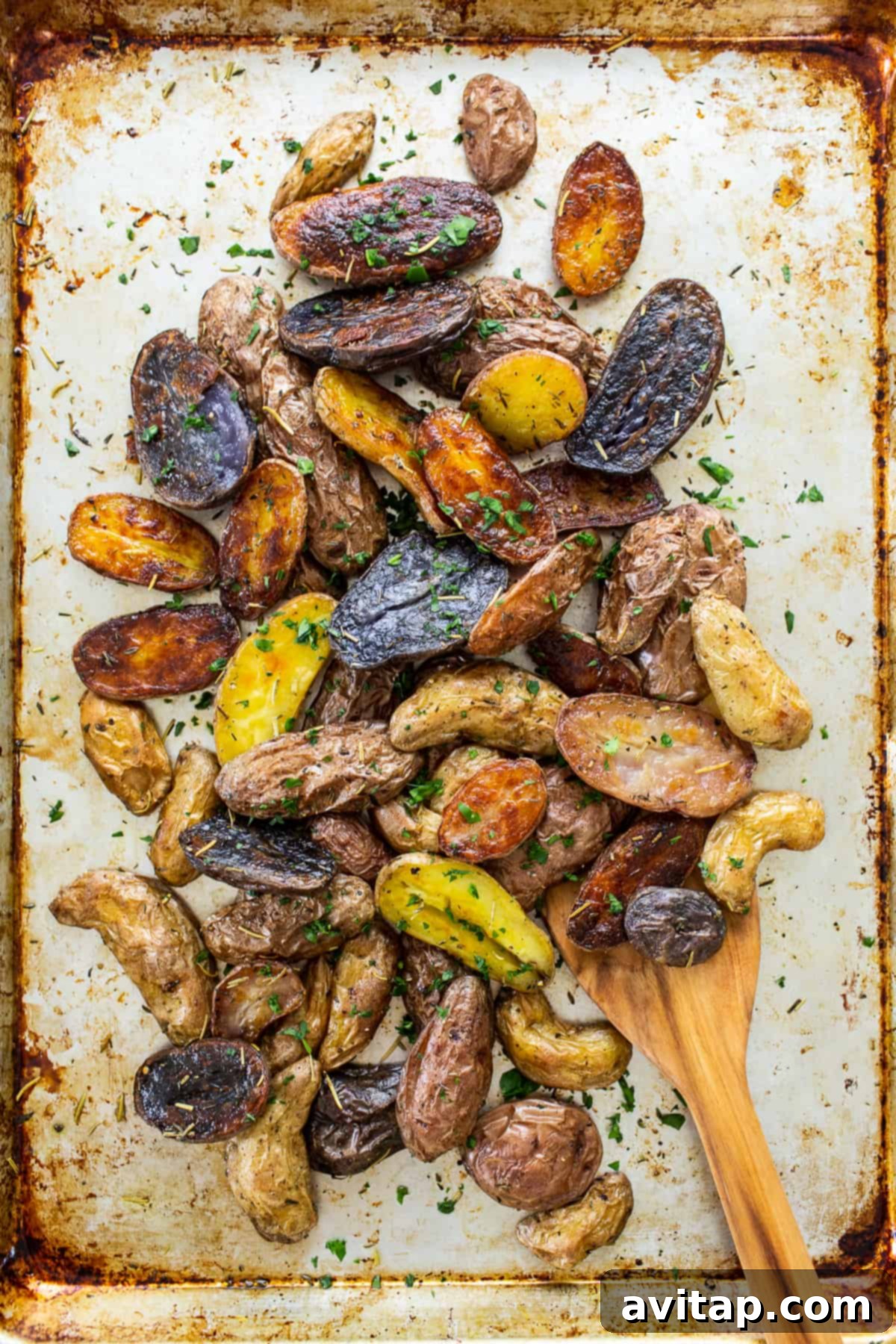 roasted potatoes with herbs on top.