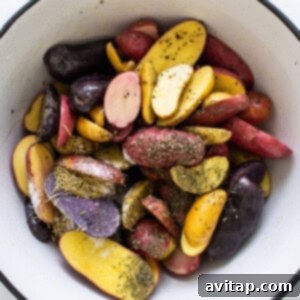 seasoning potatoes in bowl.