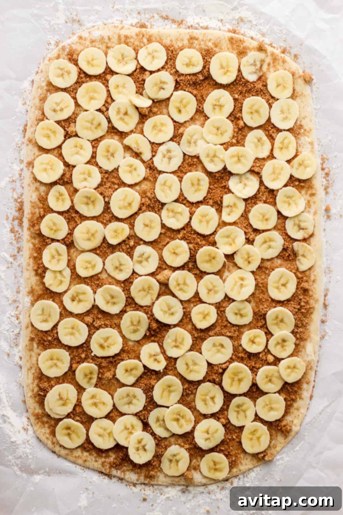 A square of banana slices on a piece of paper.