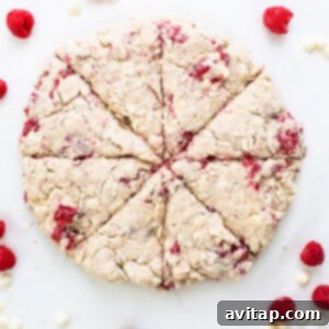 Unbaked scones, cut into wedges, arranged on a baking sheet before chilling.