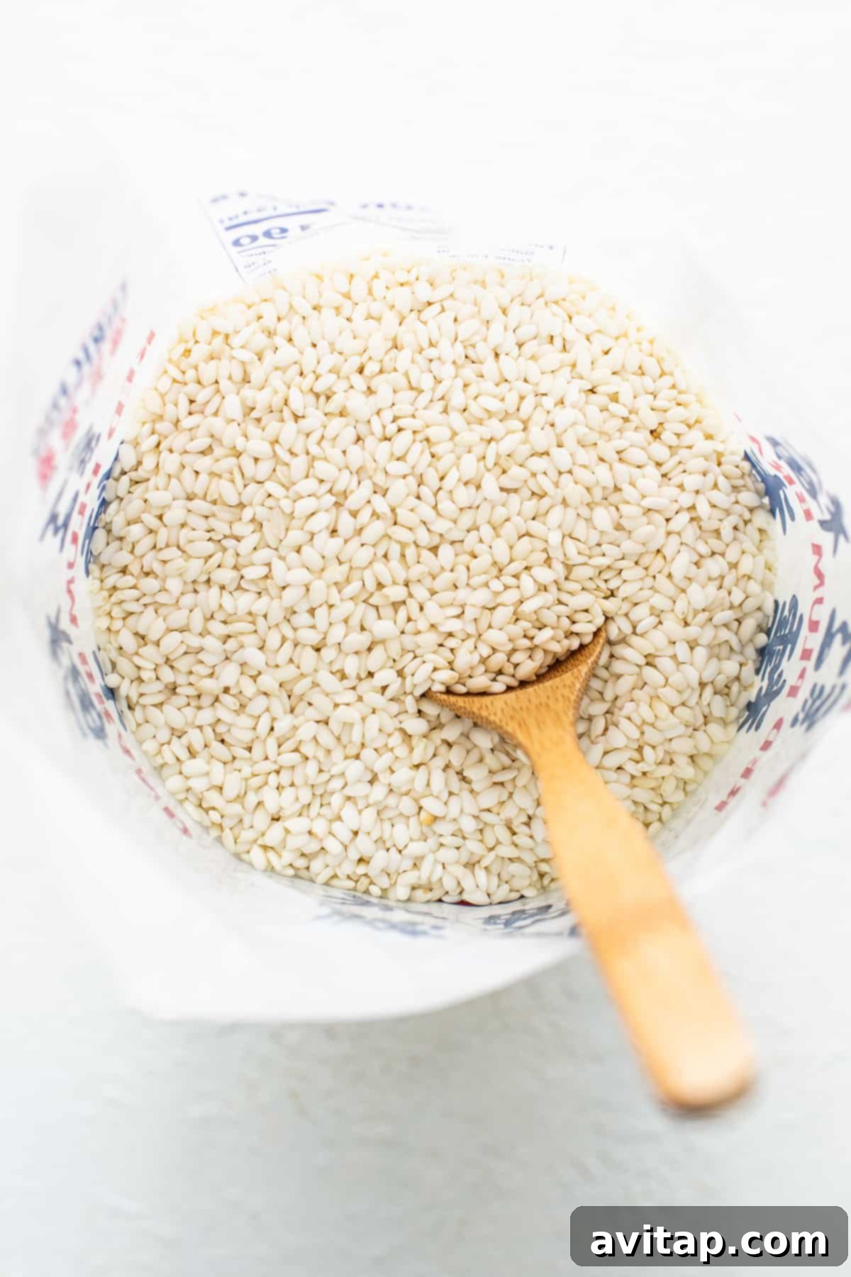 Sticky Rice Magic in the Instant Pot 3 Buckwheat groats in a bowl with a wooden spoon.
