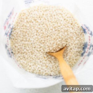 Sticky Rice Magic in the Instant Pot 8 Buckwheat groats in a bowl with a wooden spoon.