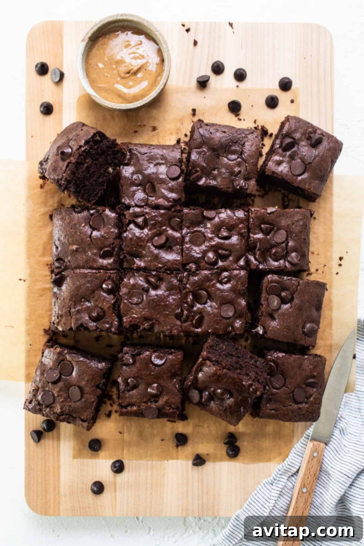 Peanut Butter Protein Power Brownies 2 Chocolate brownies on a cutting board with peanut butter.