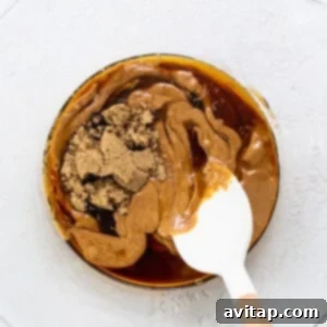 Peanut butter in a bowl with a spoon.