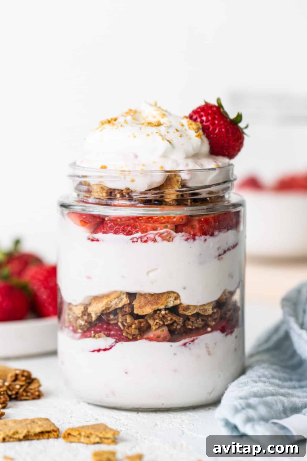 Strawberry granola parfait in a jar.