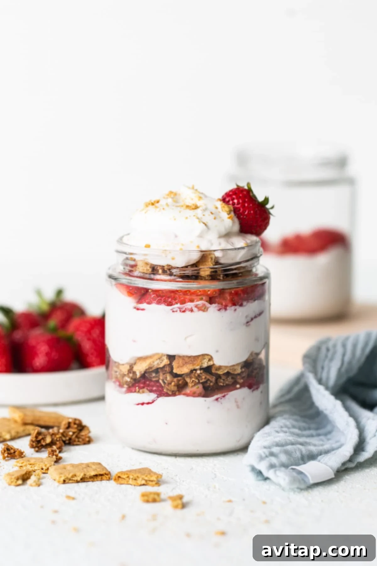Strawberry granola parfait in a jar.