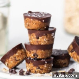 A stack of chocolate oatmeal cups on a plate, showcasing their inviting texture and rich chocolate topping.