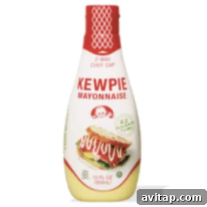 A bottle of Kewpie mayonnaise on a clean white background, highlighting its iconic design.