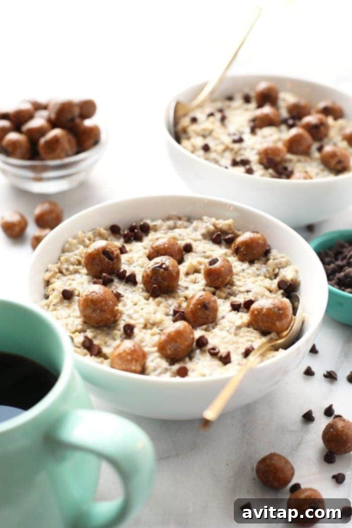 A beautifully styled bowl of Chocolate Chip Cookie Dough Oatmeal, topped with mini chocolate chips and cookie dough bites, ready for breakfast.