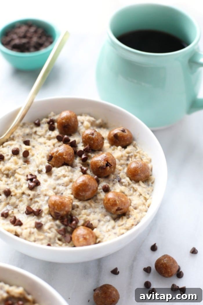 Overhead view of a bowl of Chocolate Chip Cookie Dough Oatmeal with melted chocolate chips, ready to be enjoyed as a healthy and vegan breakfast or dessert.
