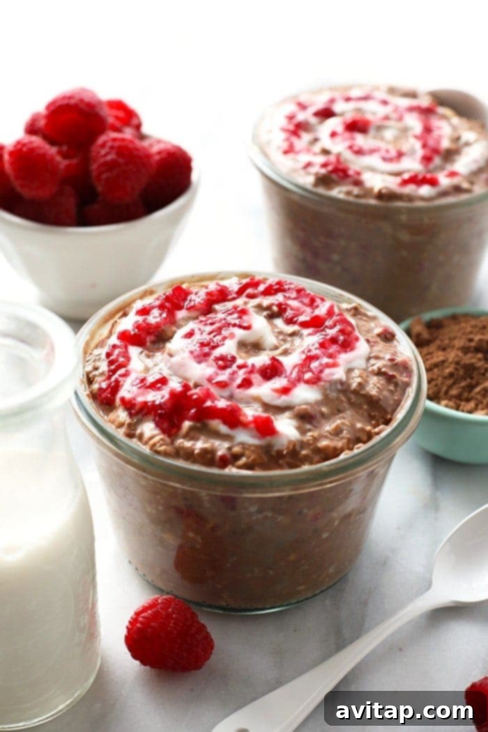 Indulge in a healthy chocolate raspberry cheesecake overnight oatmeal breakfast, prepped in under 5 minutes for a quick morning meal.