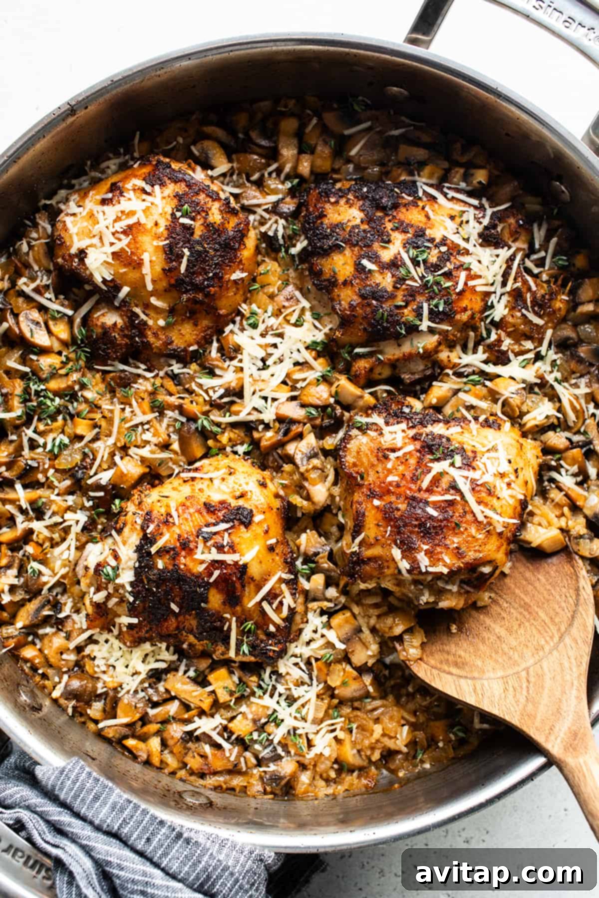 A pan filled with perfectly baked chicken and mushrooms.